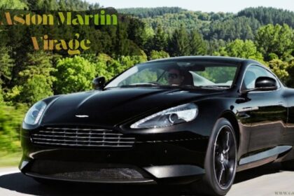 Black Aston Martin Virage luxury sports car driving at high speed.