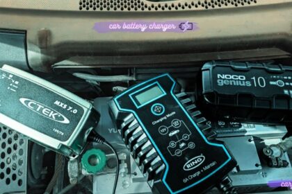 Collection of CTEK, Ring, and NOCO smart car battery chargers placed on a vehicle battery inside an engine compartment.