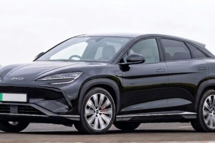 BYD black electric SUV coupe on UK road representing the rise of Chinese cars in the UK market
