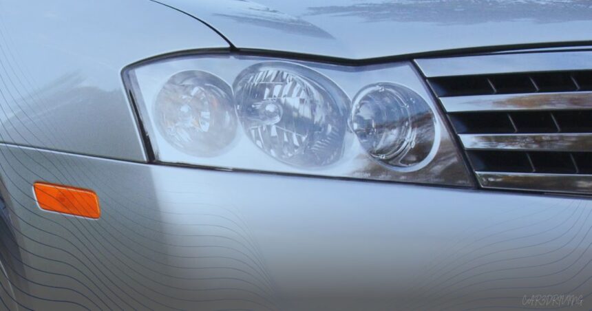 Close-up of the front headlight assembly and chrome grille of a silver Infiniti M45S sedan.