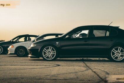 Three modified cars parked on an airfield at sunset, ideal for drivers looking for a guide on how to sorn my car in the UK.