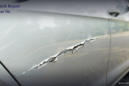 Close-up of a deep gash and paint damage on a silver car door, illustrating the need for professional car scratch repair near me
