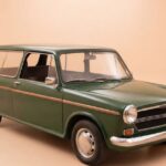 Vintage green Austin 1300 classic car for sale, showcasing the iconic British compact estate design.