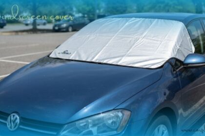A high-quality car windscreen cover protecting the windshield of a blue vehicle from the sun.
