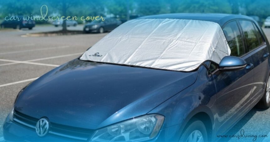 A high-quality car windscreen cover protecting the windshield of a blue vehicle from the sun.