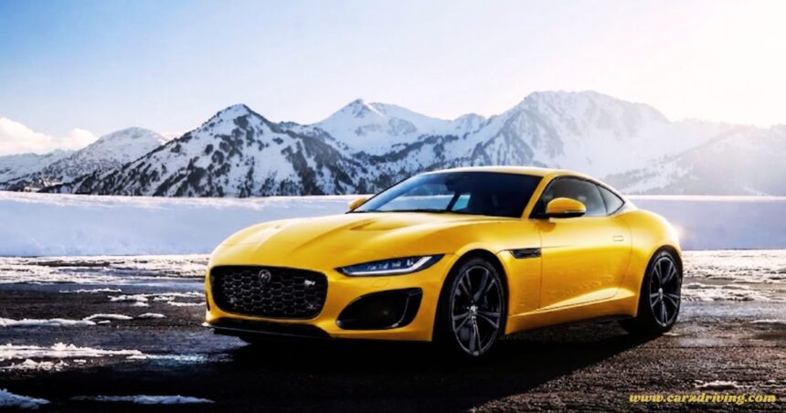 "Bright yellow Jaguar F-Type R coupe parked on a snowy road with mountains in the background."