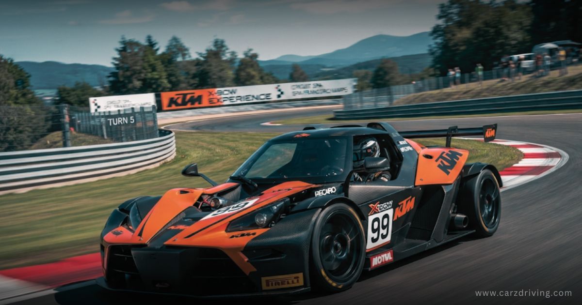 Black and orange KTM X Box car driving on a racetrack turn