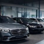 Premium Name German car brands including Mercedes-Benz, BMW, and Audi on display in a luxury car showroom.