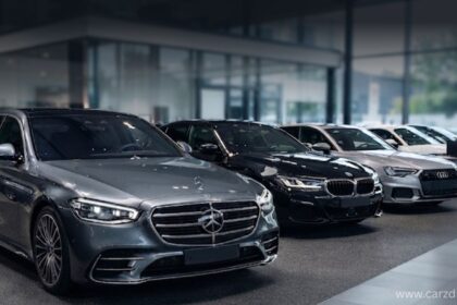 Premium Name German car brands including Mercedes-Benz, BMW, and Audi on display in a luxury car showroom.