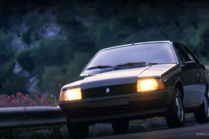 Front view of a classic R Fuego coupe illuminated at night.