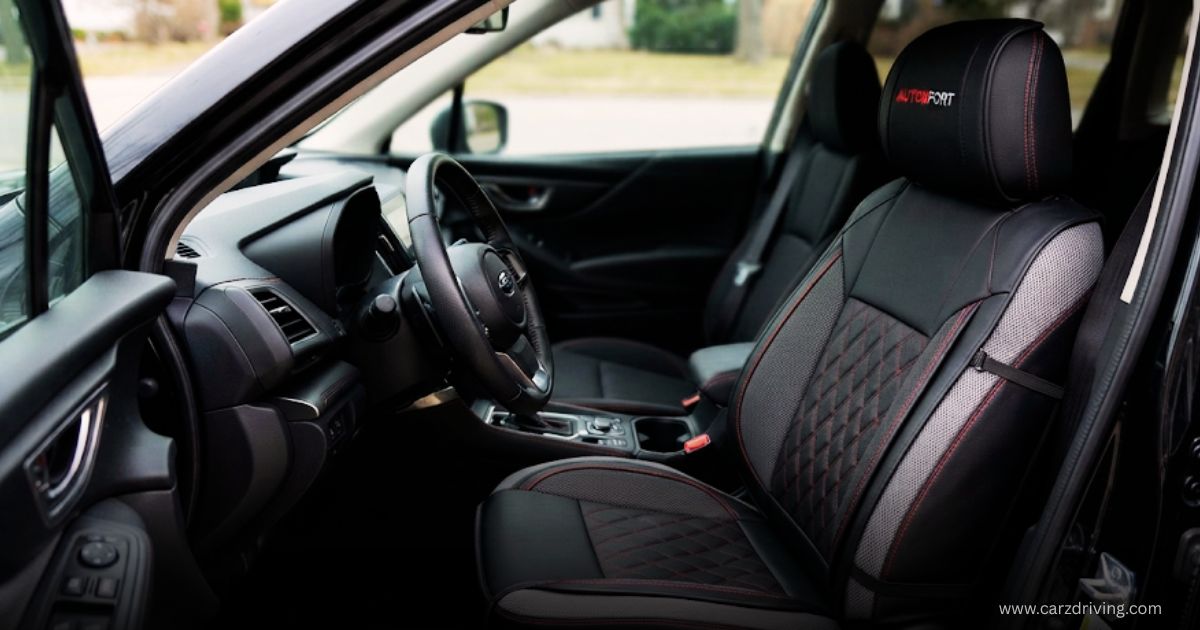 Black and gray AutoFort leather car seat cover featuring red contrast stitching and a diamond-quilted insert installed on a front driver's seat.