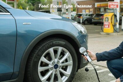 "Checking Ford Focus tyre pressure at a service station using an air hose gauge."