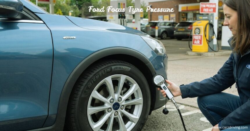 "Checking Ford Focus tyre pressure at a service station using an air hose gauge."
