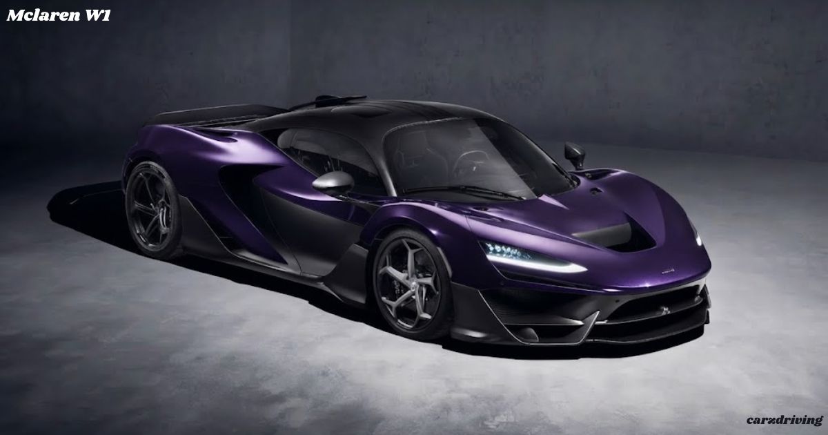 Front profile view of a dark purple McLaren W1 super sports car with aggressive aerodynamics in a dark studio setting.