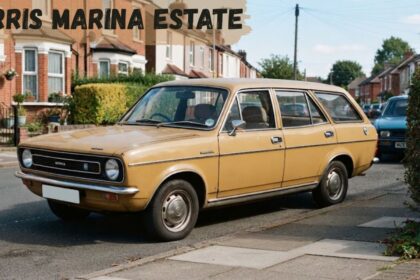 A classic beige vintage Morris Marina Estate car parked on the side of a residential street in front of brick terraced houses