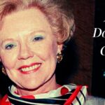 Portrait of Jane Dobbins Green smiling, wearing a red and striped scarf with bold text reading "Jane Dobbins Green" on the right.
