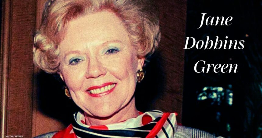 Portrait of Jane Dobbins Green smiling, wearing a red and striped scarf with bold text reading "Jane Dobbins Green" on the right.
