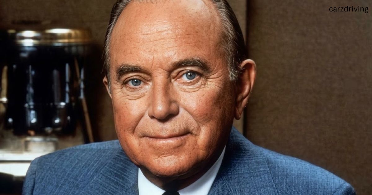 Portrait of Ray Kroc in a blue suit.