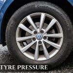 Close-up of a Volkswagen alloy wheel and Continental ContiPremiumContact 5 tyre with the text VW Polo tyre pressure overlay